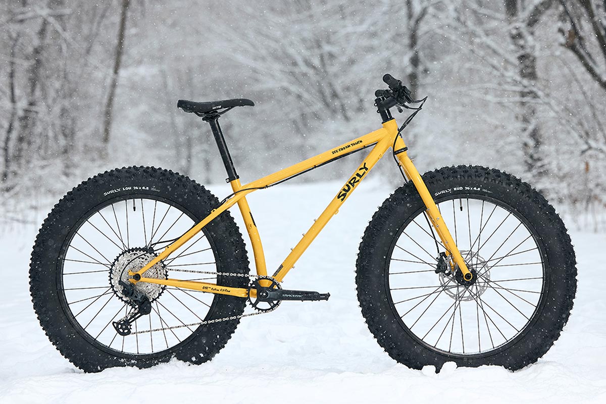 Surly Ice Cream Truck bike, Warm Cheese yellow color side view outside in snow