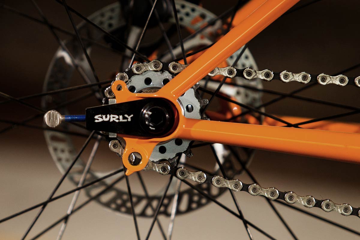 Surly Lowside bike drive-side detail showing Snuggnut chain tensioner, cog and chain
