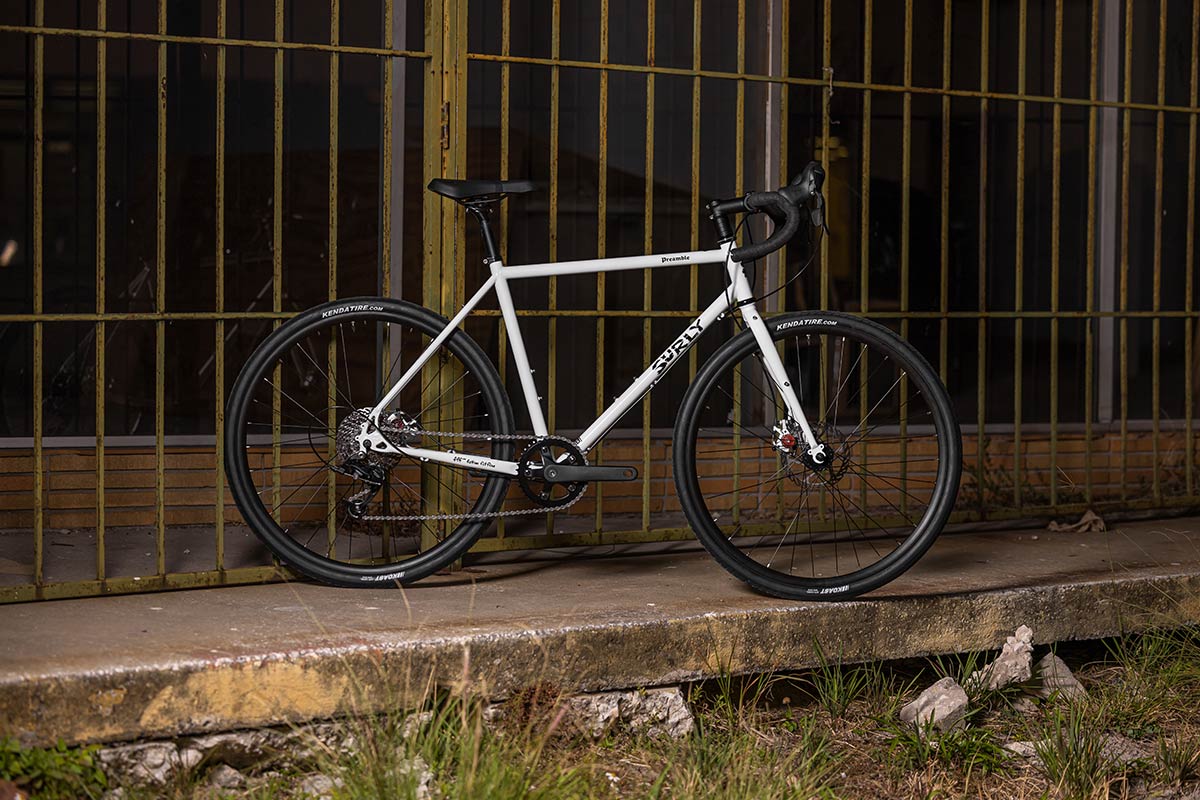 Preamble Drop Bar Thorfrost White bike side view parked next to building