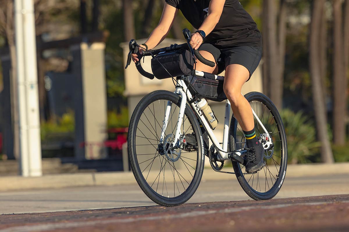 Person riding Preamble Drop Bar bike on street, focus on bike