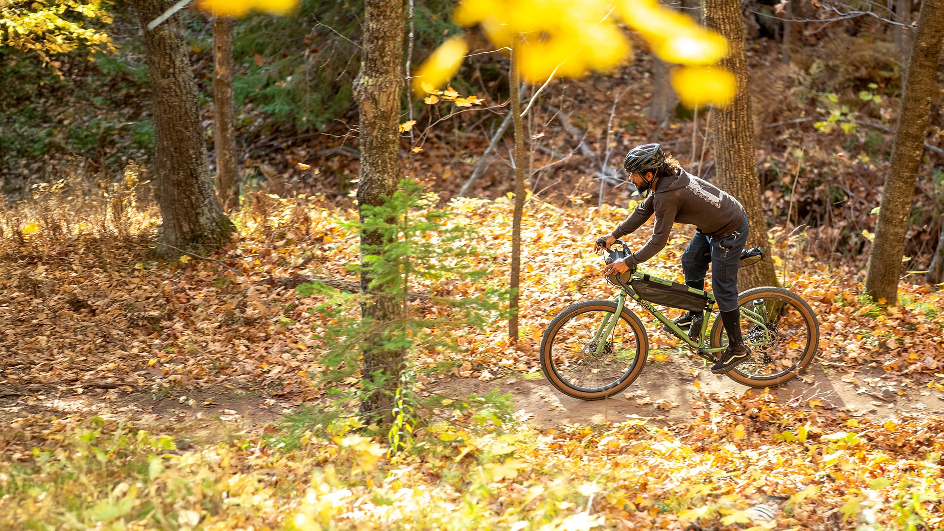 Person riding trail on Surly Grappler