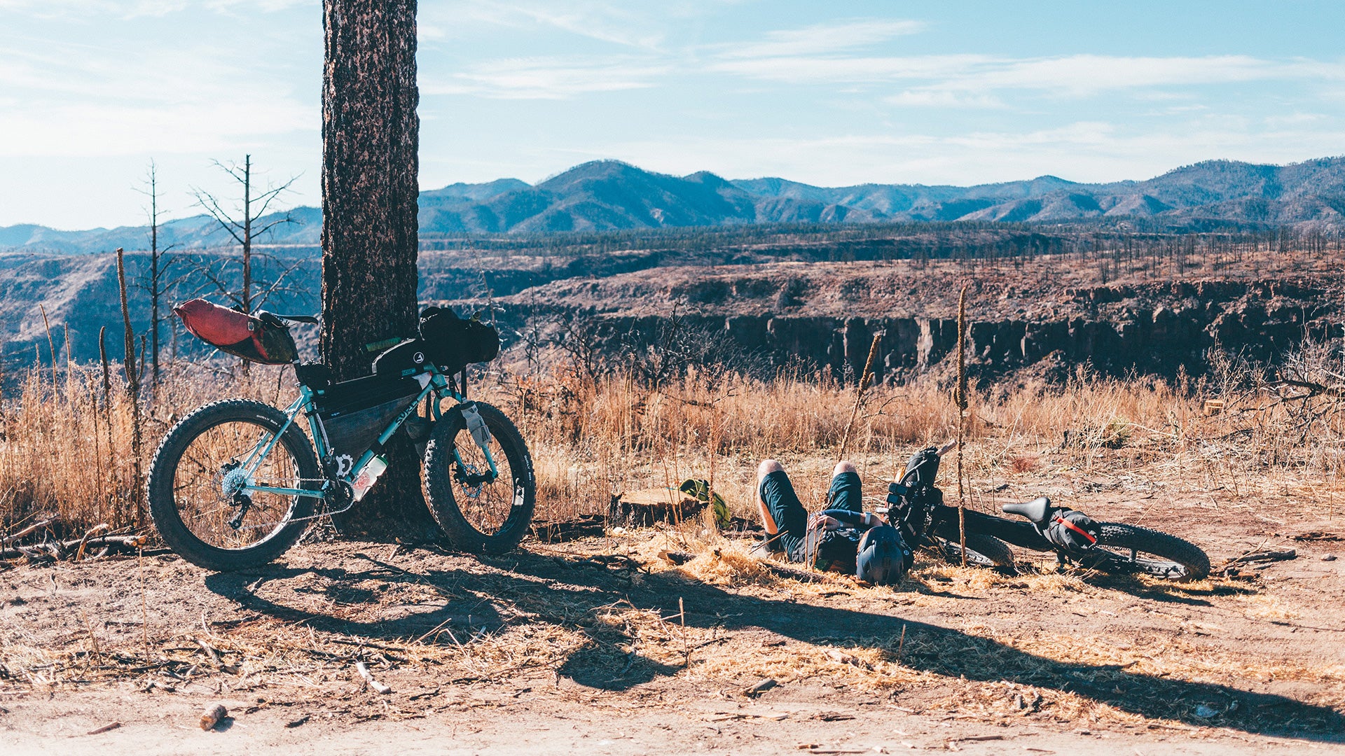 Surly Wednesday parked person laying down in high desert