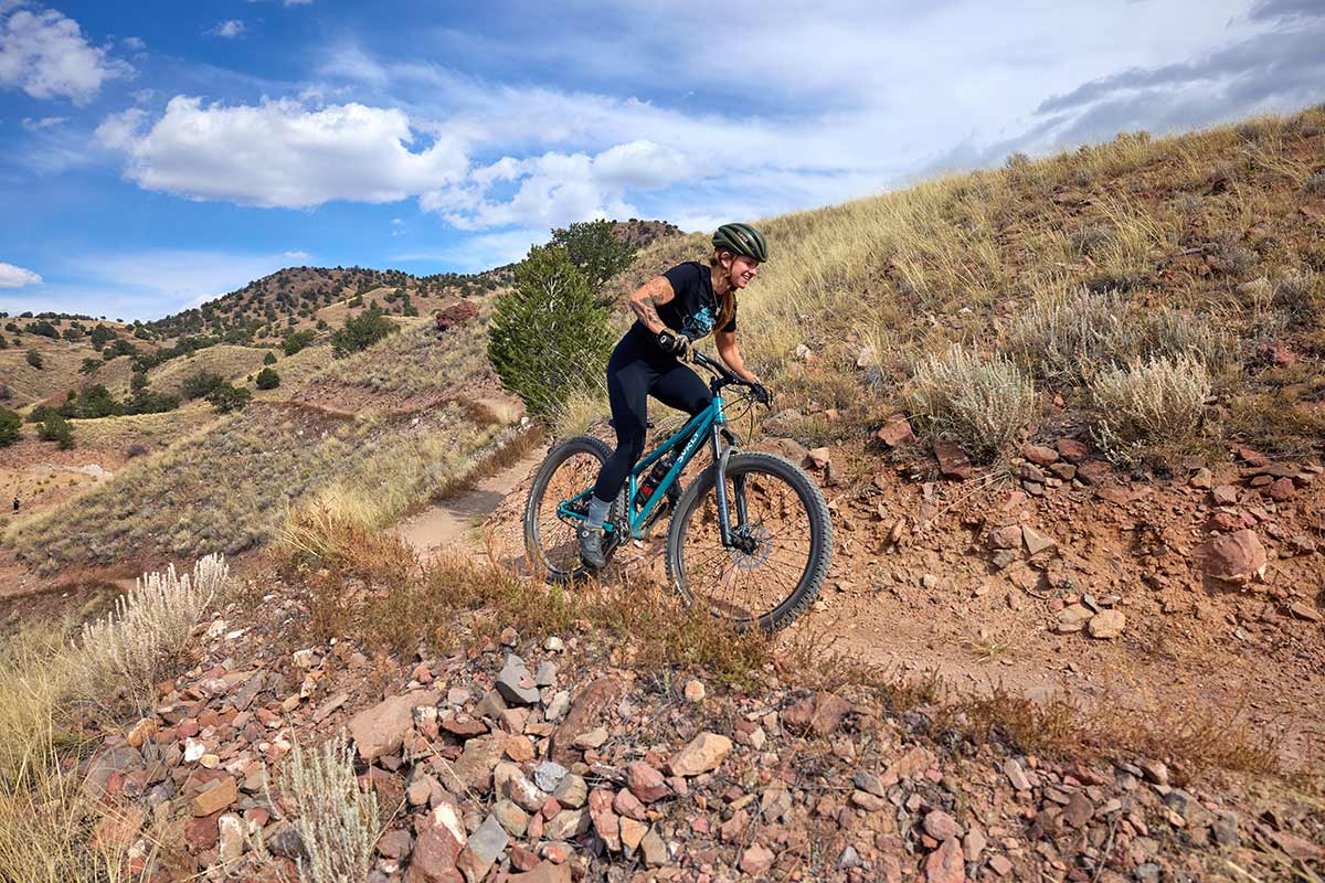 Person riding Karate Monkey front suspension on high elevation desert trail