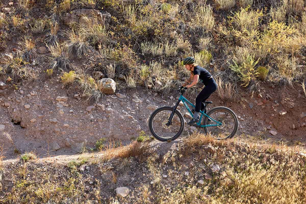 Person riding Karate Monkey front suspension going downhill