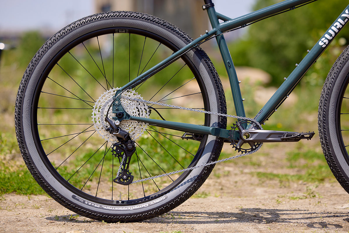 Surly Ogre bike green color side view focus on drive side rear dropout and rear wheel