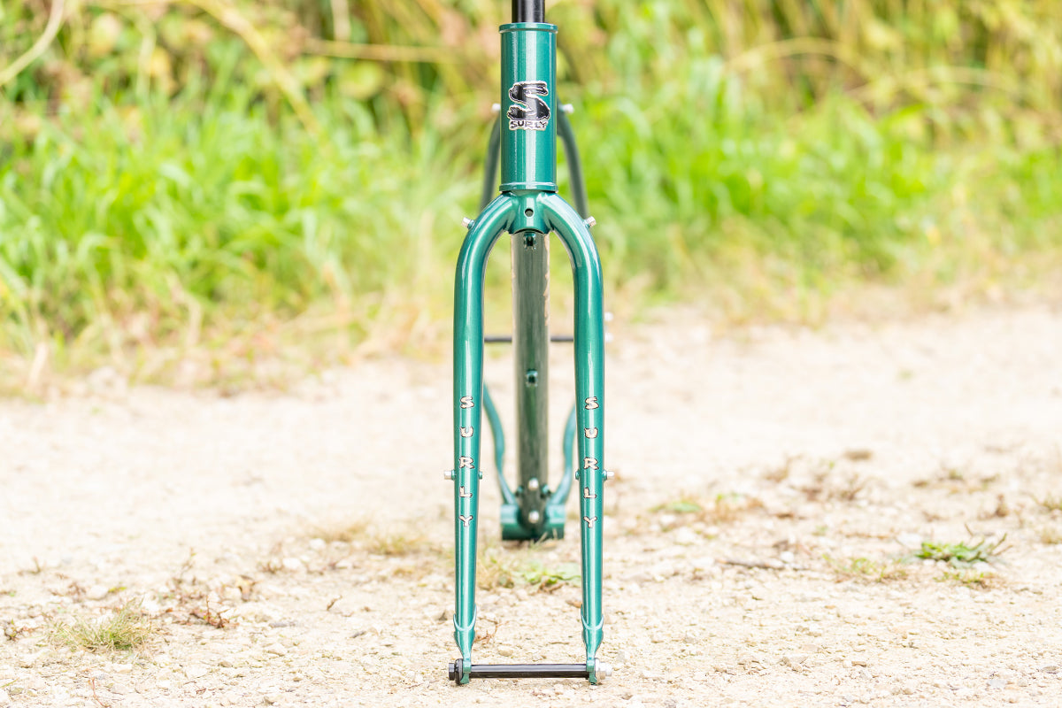 Surly Straggler Frameset in Subtropic Algae color straight-on view outside on gravel road