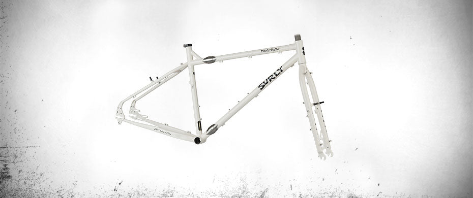 Surly World Troller frameset Milque color side view showing frame couplers on top and down tubes