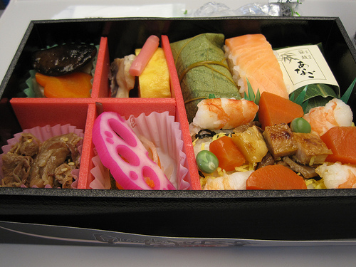 Downward angle view of a bento box full of Japanese cuisine