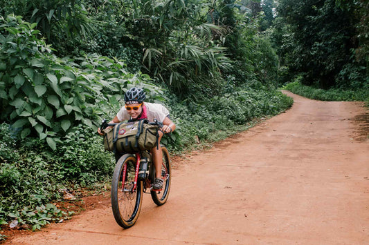 Rider Immu Tucked Riding a Bike Down a Hill