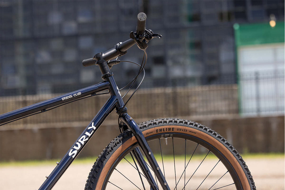Surly Bridge Club bike outside showing front of bike with a blurred background