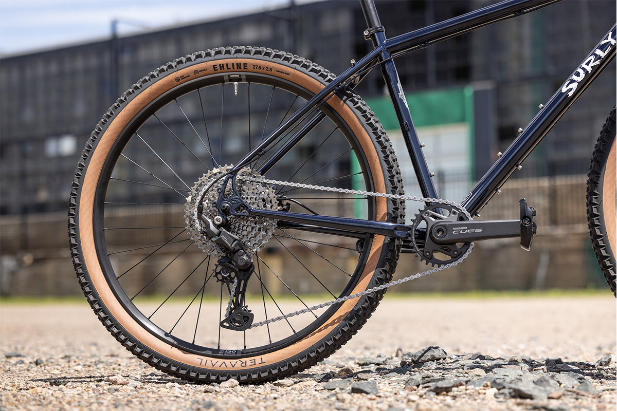 Surly Bridge Club bike outside focus on rear wheel and drivetrain with a blurred background
