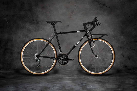 Surly Pack Rat bike side view with front 24-Pack Rack Hi-Viz Black color