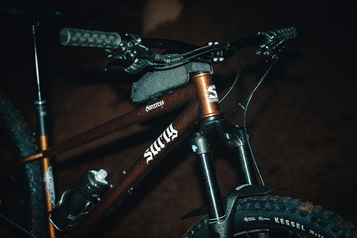 Close-up of a bicycle with 'Surly' branding on a dark background