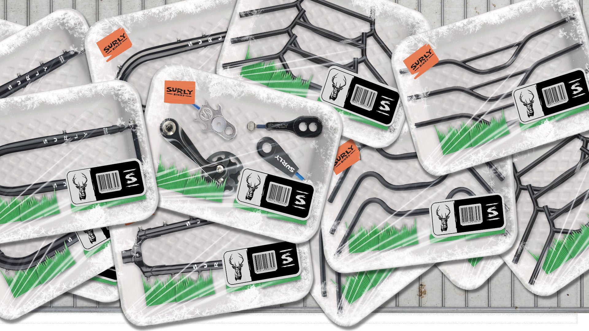 Surly handlebars, forks, and single-speed parts shown in mocked-up grocery store meat packaging enclosed in cellophane