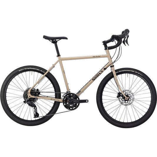 Surly Disc Trucker bike 26-inch wheels in tan color side view on white background