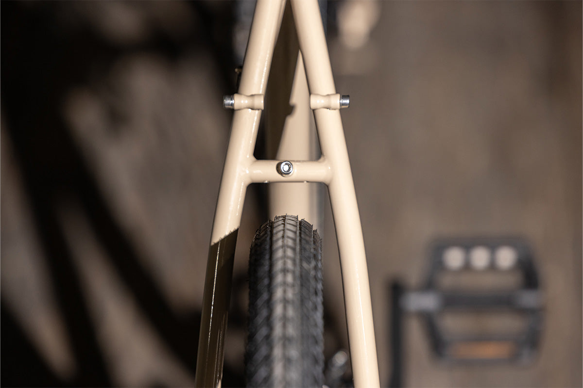 Close-up of a bicycle frame with a blurred background