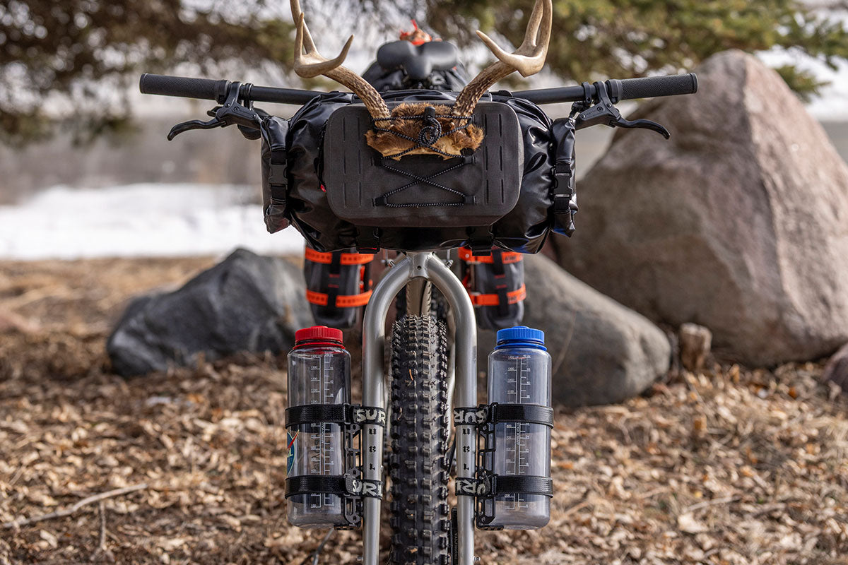 Bircycle with gear and water bottles on a natural landscape