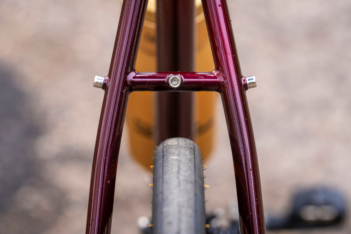 Close-up of a rear tire frame clearance with a blurred background