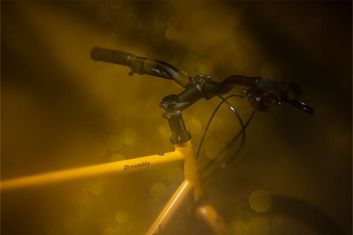 Close-up of a bicycle handlebar with a blurred background