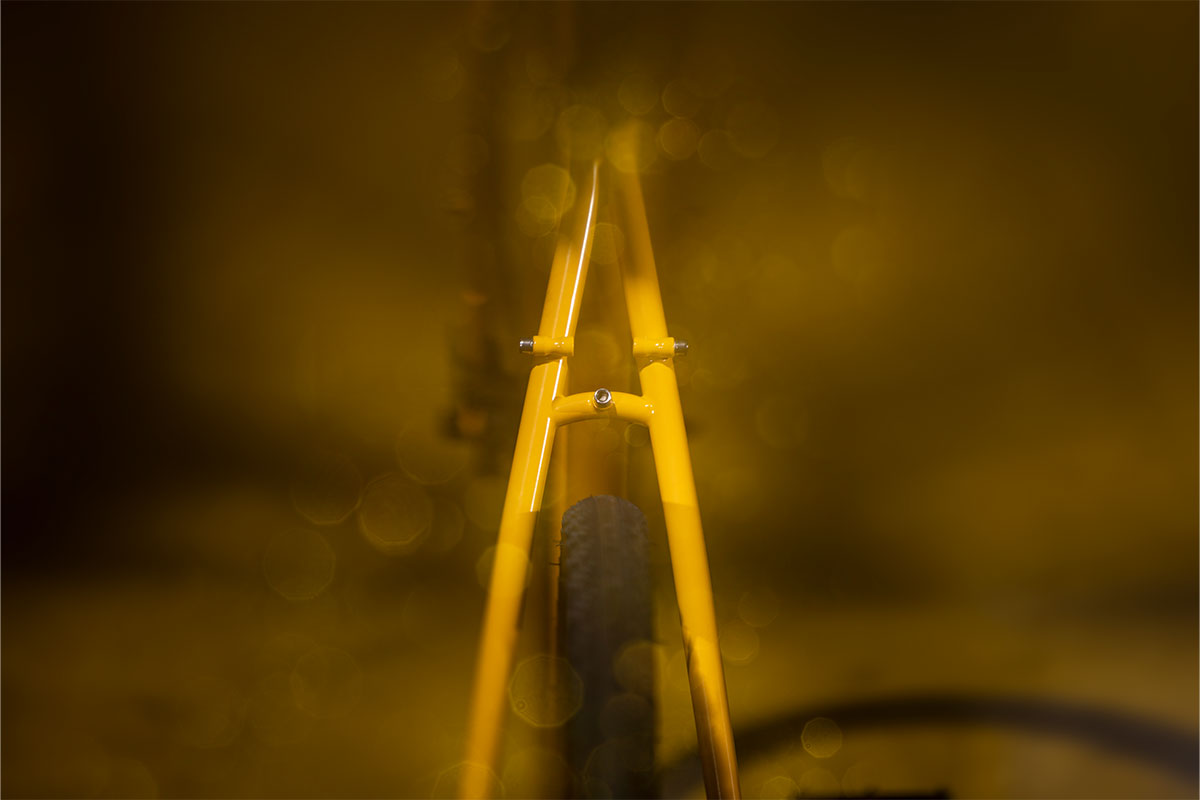 Yellow metal frame against a dark, blurred background