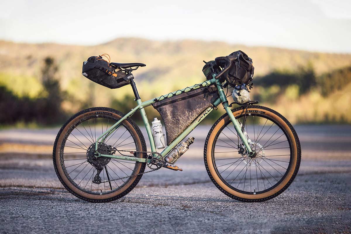 Grappler loaded for bikepacking, with seat pack, frame pack, handlebar bag and front rack
