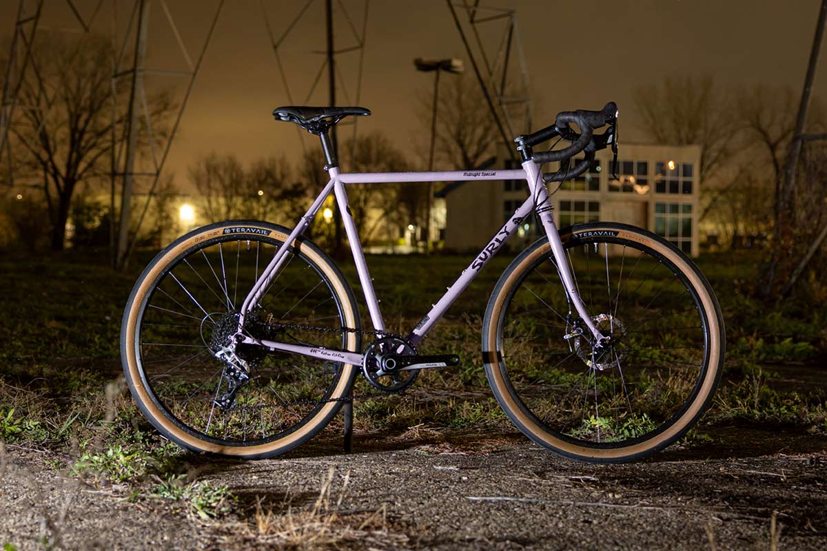 Midnight Special, Metallic Lilac color, complete bike side outdoor at night