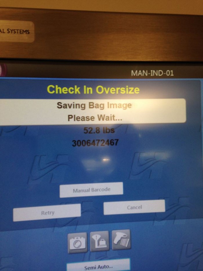 A screen from a luggage check-in terminal,  showing the weight of a bag