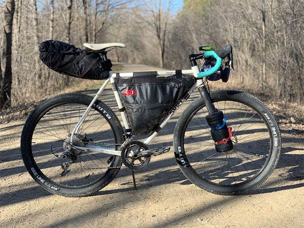 Dan's Surly Midnight Special before new paint, set-up for bikepacking on gravel road