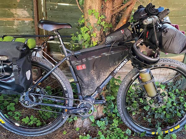 Surly Ogre set up for bikepacking with bags and rear rack/pannier set-up