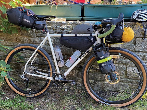 White Surly Midnight Special decked out with bikepacking bags/gear