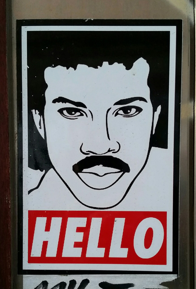 Poster sign drawing of Lionel Richie looking straight ahead with the word 'HELLO' underneath