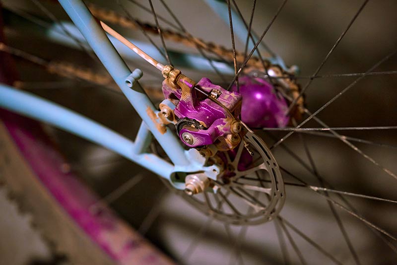 Detail of Paul's custom Surly Krampus focus on rear brake caliper, and rotor