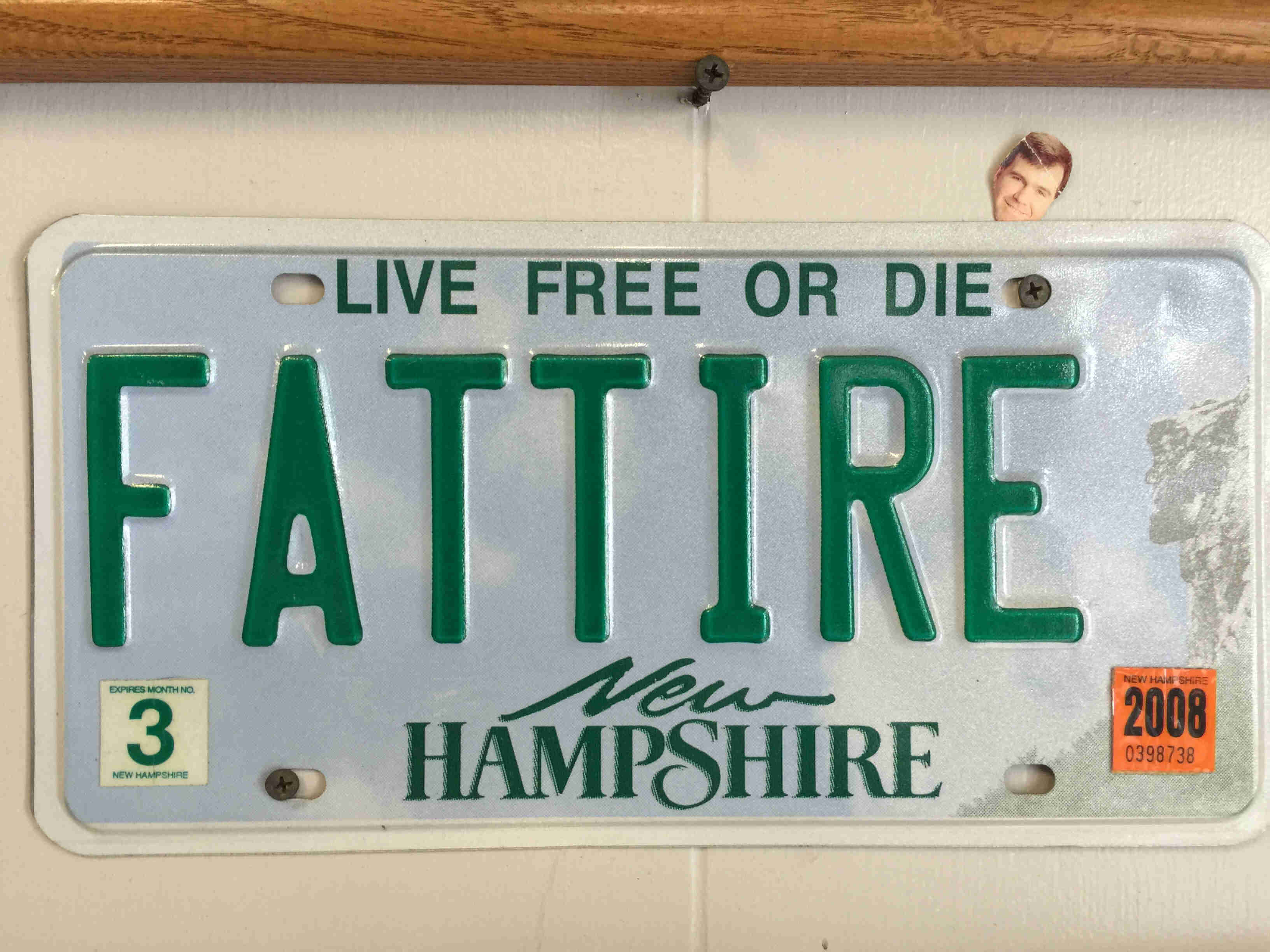 A New Hampshire license plate the shows, FATTIRE