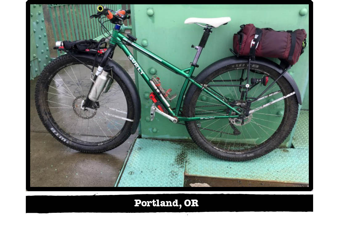 Left side view of a Surly bike, green, leaning on a green steel beam - Portland, OR tag below image
