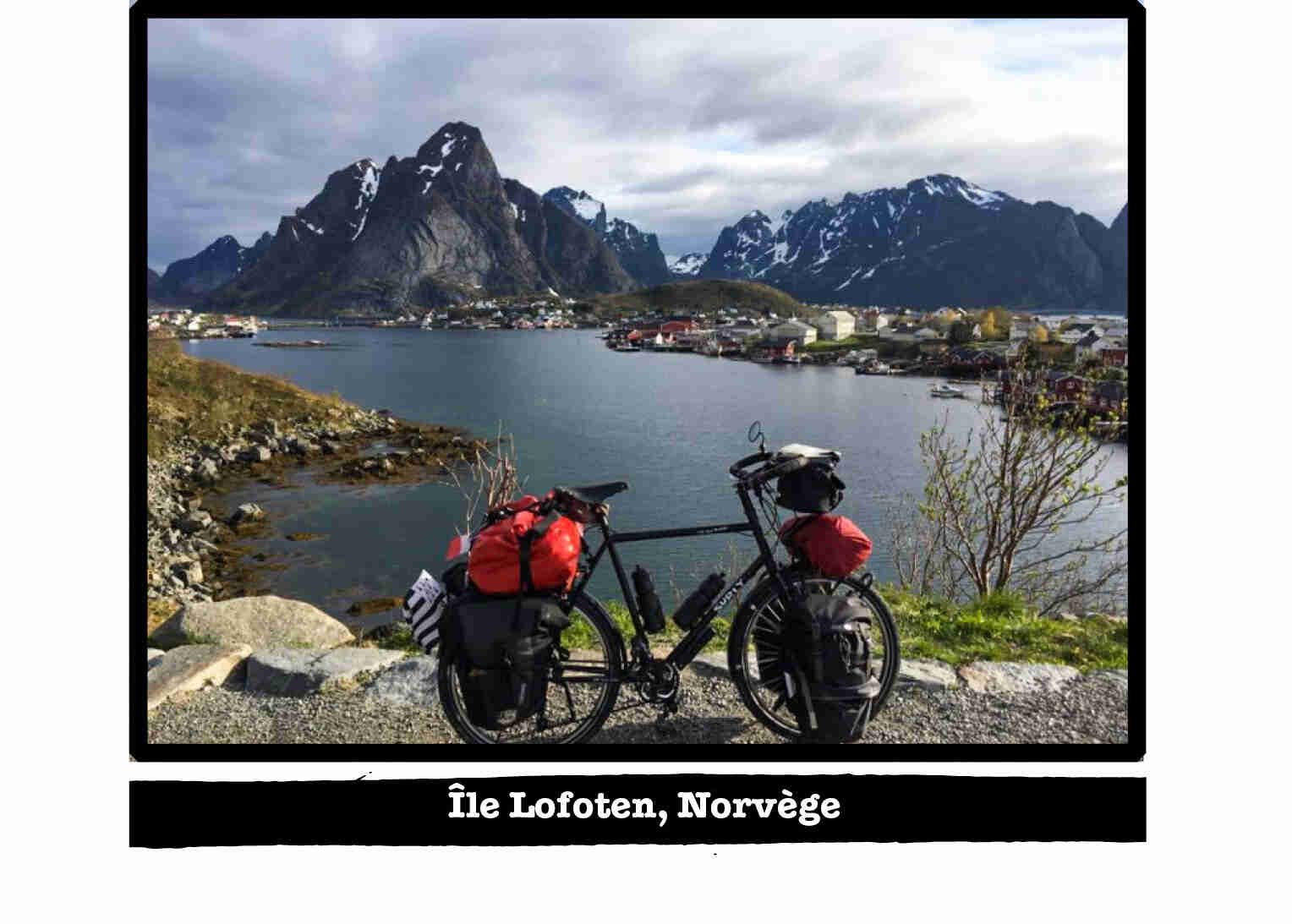 Right profile of a Surly bike, black, on the edge of a lake in the mountains - Ile Lofoten, Norvege tab below image