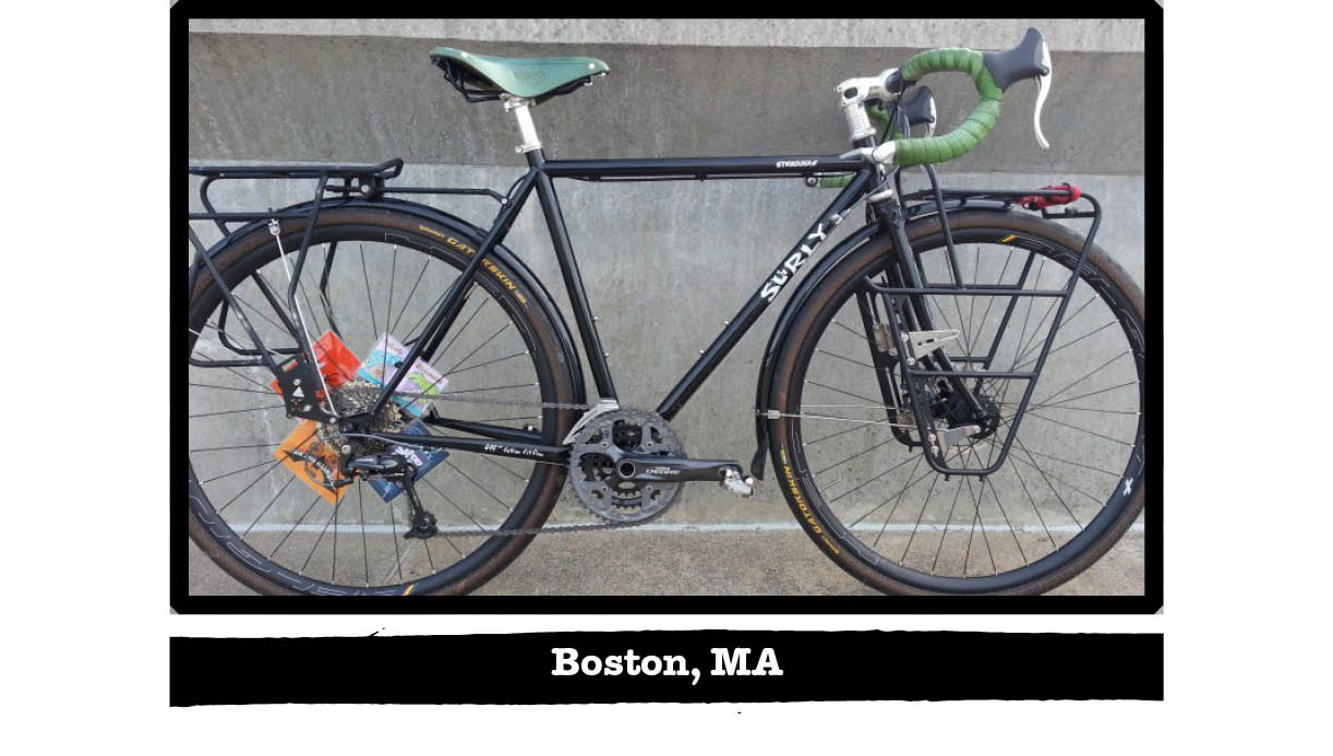 Right profile of Surly Straggler bike, black, against a cement wall - Boston, MA tag below image