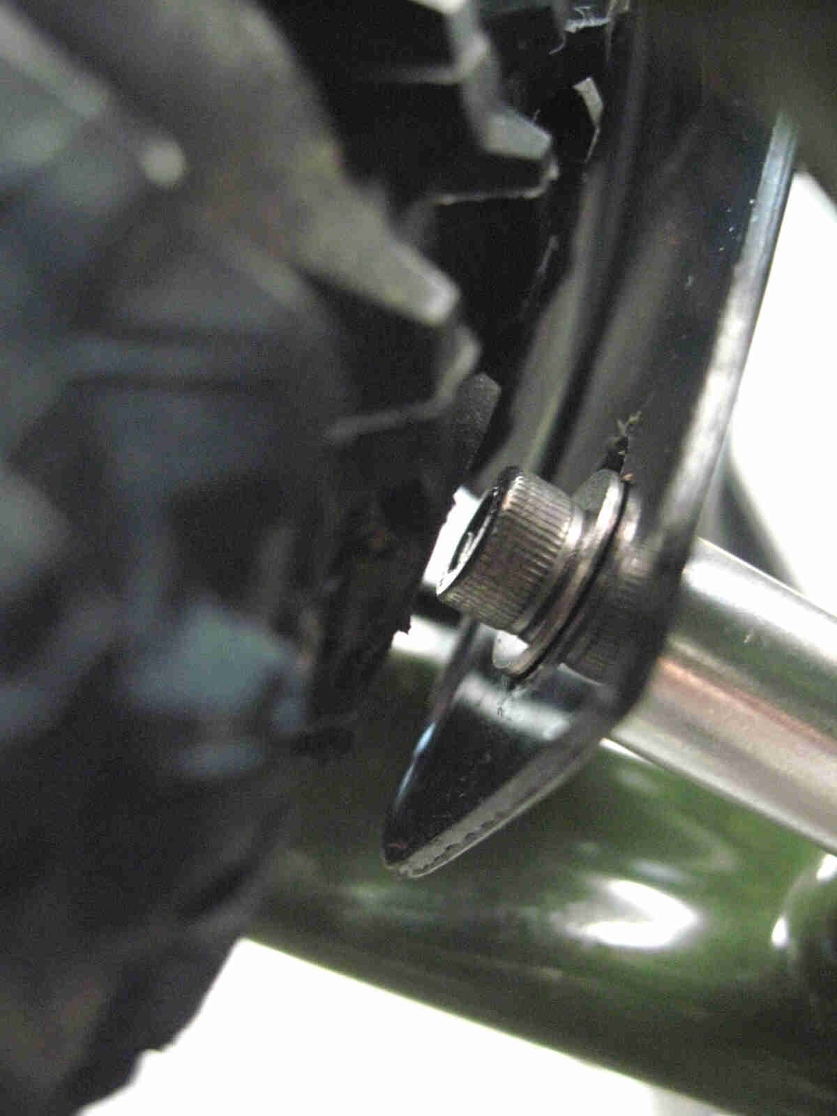 Surly Ogre bike - green - rear fender mounting bolt detail - close up view