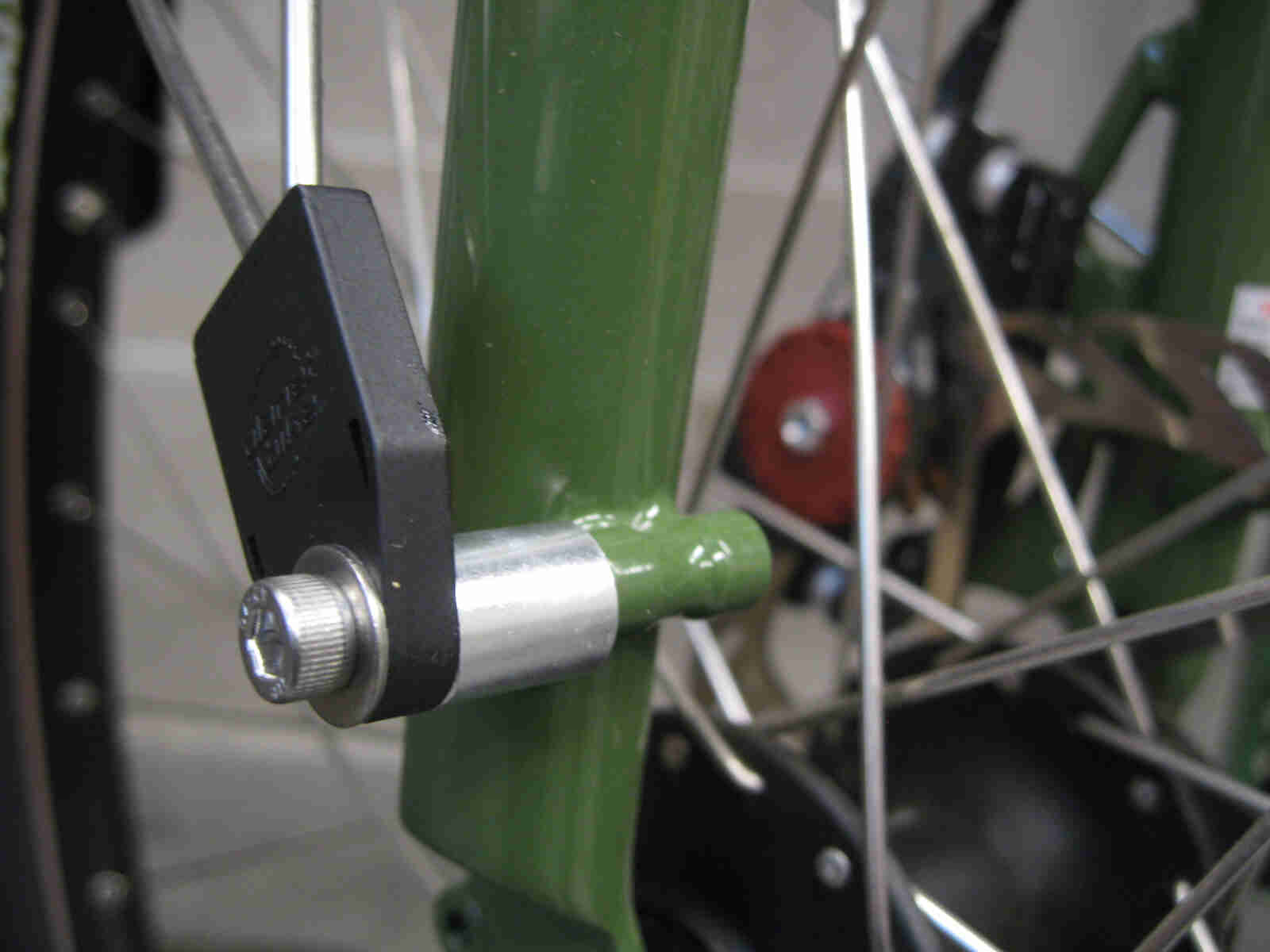 Surly Ogre bike - green - fork, front fender spacer nut detail - front, right side, close up view