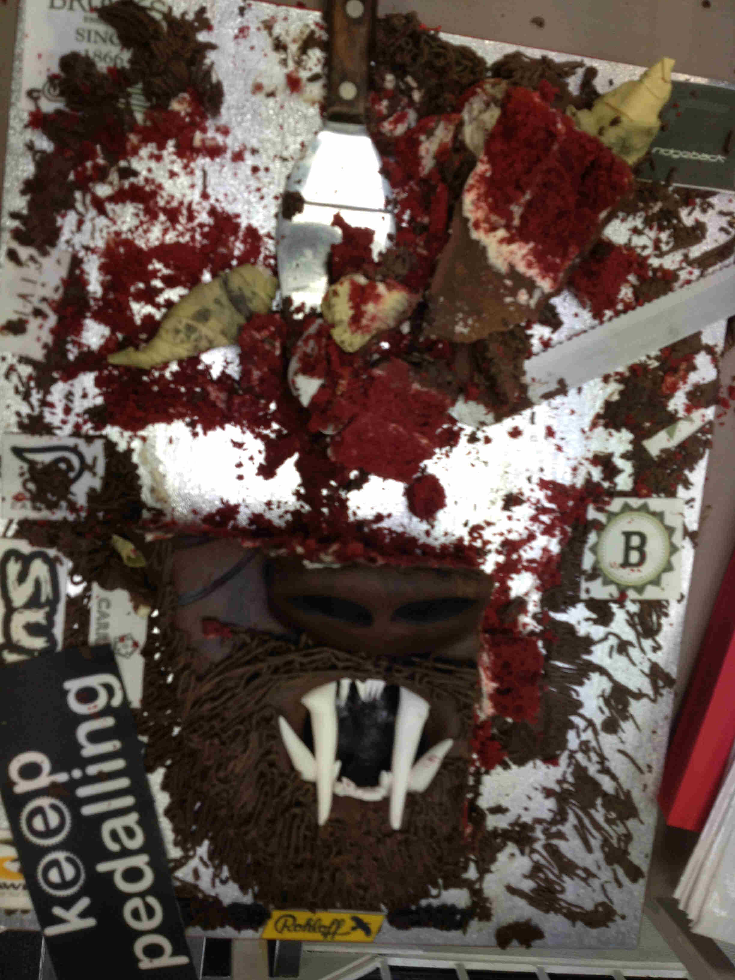 Downward view of a half eaten cake, that was made to look like a Krampus monster