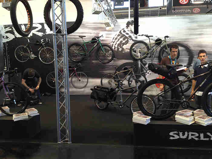 The Surly Bikes display at the Eurobike show, with bikes on stands and mounted to walls with graphics on them