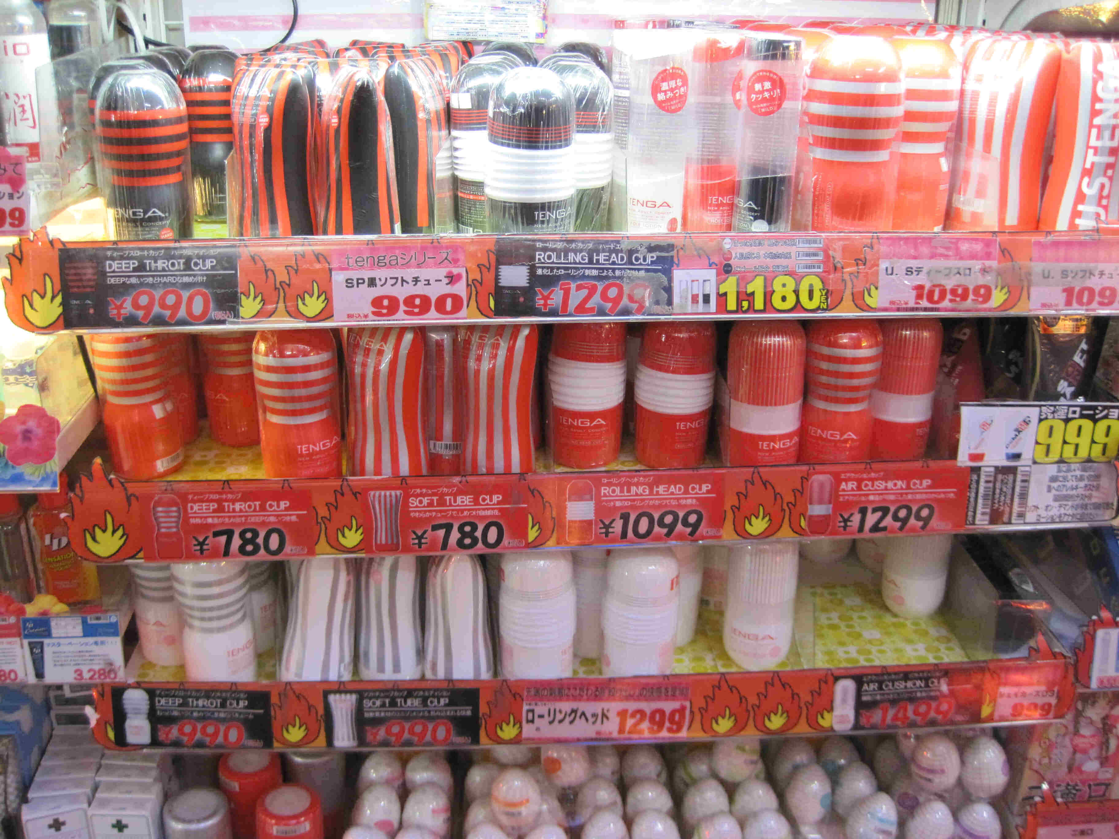 Front view of product shelves, in a Japanese store, with various items on them