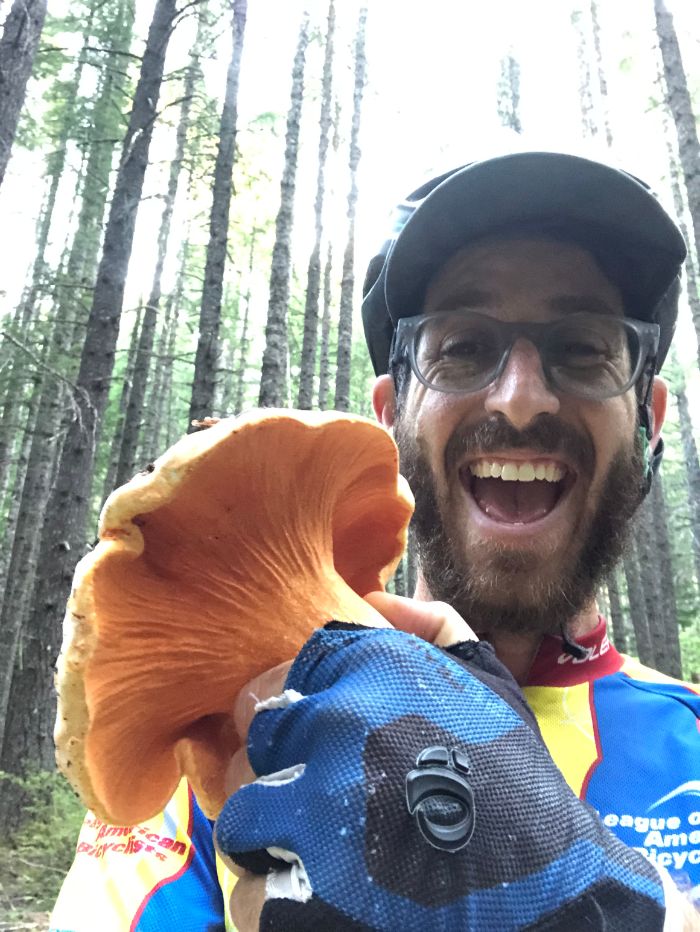 Jake Smiling with a Chanterelle Mushroom