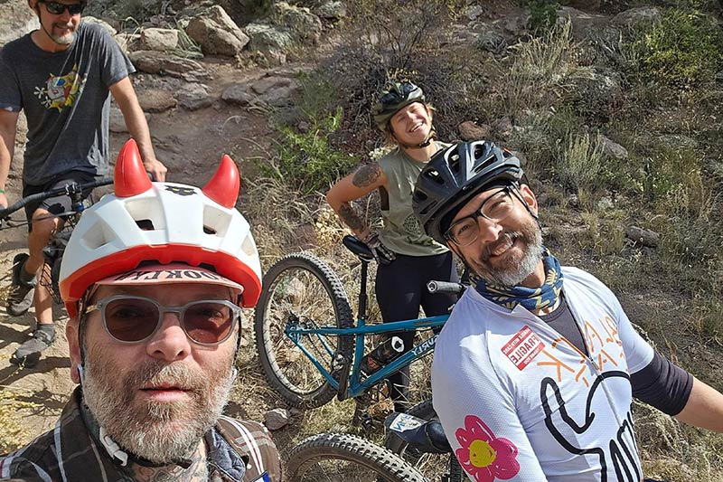 Single speeders group selfie on trail