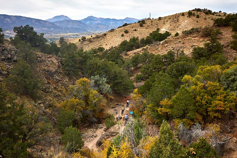 Cyclists riding in ravine