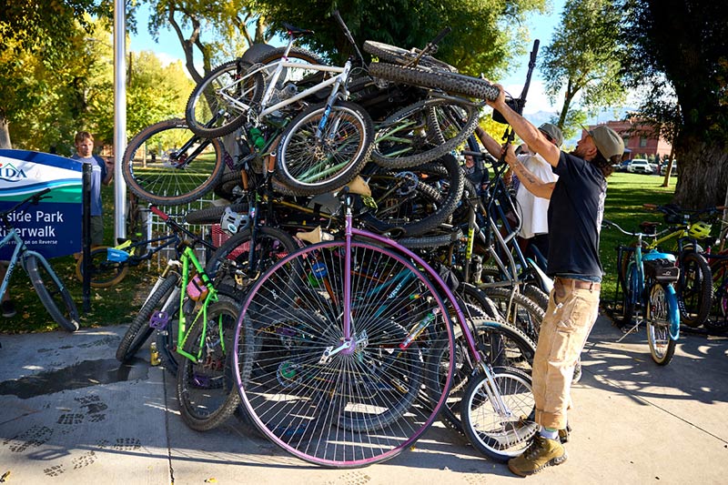 Person adding bike to bike pile over there head outside