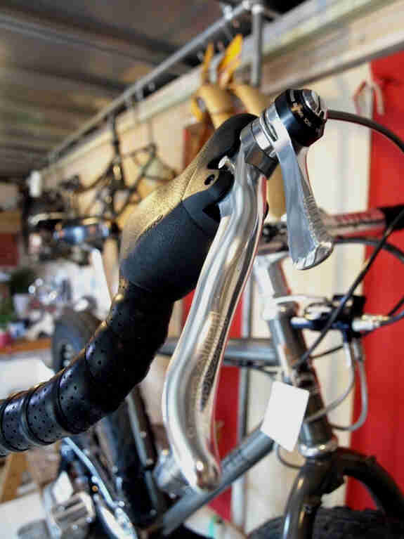 Close up view of a Surly Moonlander fat bike, right brake lever and shifter detail