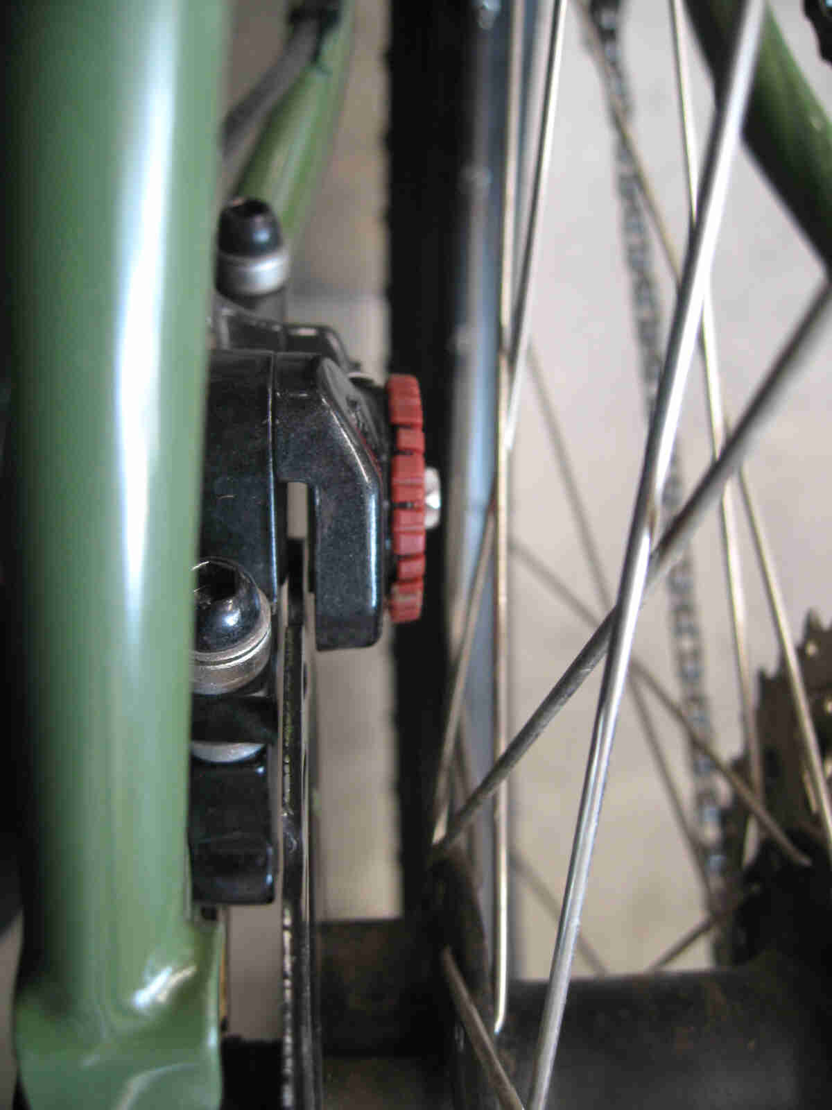 Surly Ogre bike - green - rear disc brake caliper detail - rear, left side, close up view