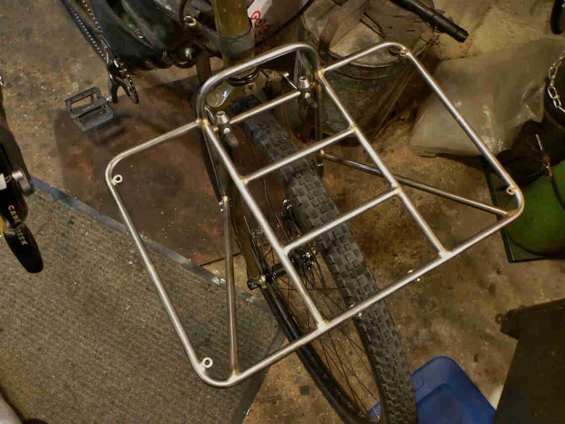 Downward view of a Surly 24-Pack rack prototype mounted to a bike fork