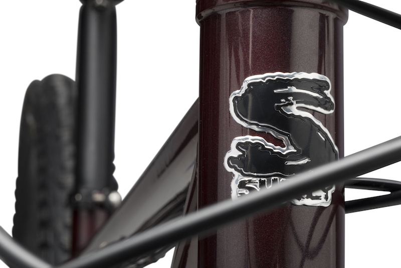 Front view zoom in of the head tube from a Surly Krampus bike, colored in Pickled Beet Red, against a white background