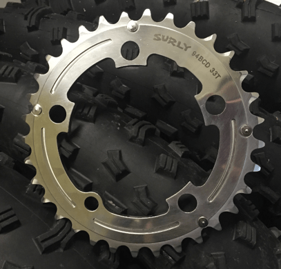 Surly Stainless Steel Outer Chainring - Downward full view - on top of tires